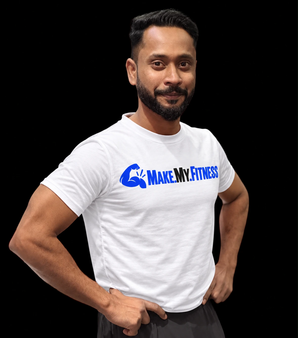 Kumar Abhishek, MakeMyFitness lead coach, wearing a white MakeMyFitness T-shirt with hands on hips